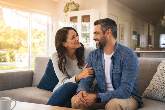 Wife and husband sharing a proud, affectionate moment at home
