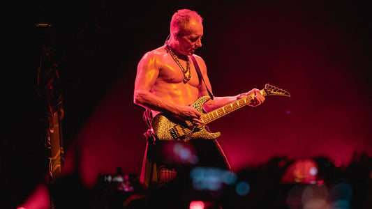 Phil Collen playing guitar at the O2 Arena in 2018