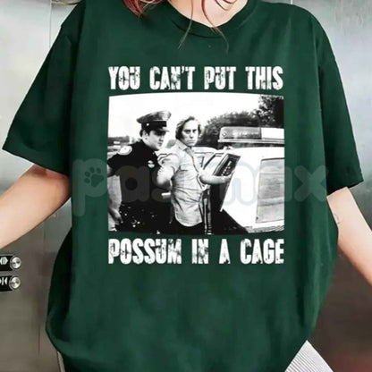 You Can’t Put This Possum In A Cage T-Shirt – Funny George Jones Arrest Outlaw Country Unisex Cotton Tee