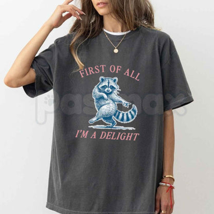 Comfort Colors® "First of All, I'm a Delight" Funny Raccoon T-Shirt – Sarcastic Animal Quote Graphic Tee, Humorous Chaos Unisex Top