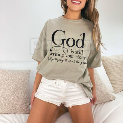 "God Is Still Writing Your Story" Christian T-Shirt – Inspirational Faith Graphic Tee, Premium 100% Cotton Grace Top, Soft Lived-In Heavyweight Storyteller Shirt, Made in USA