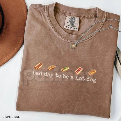 Comfort Colors® Vintage "Bad Day To Be A Hot Dog" T-Shirt – Retro Summer BBQ Mascot Tee, Funny 4th of July Women's Graphic Top, Sarcastic Glizzy Season Shirt
