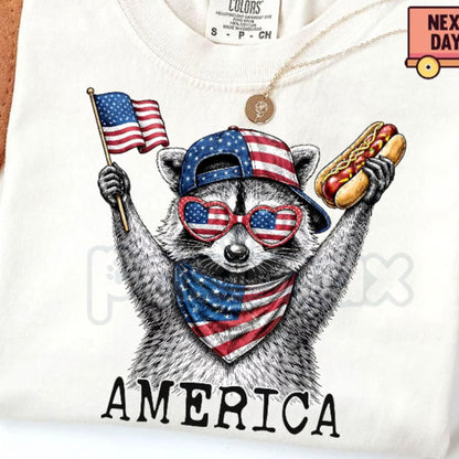 Comfort Colors® America Raccoon Hot Dog T-Shirt – Funny 4th of July Raccoon Tee, Retro Trash Panda Patriotic USA Holiday Gift Top