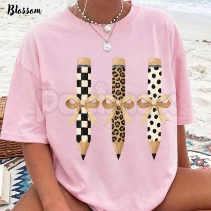 Comfort Colors® "Brushstroke Pencil Bow" T-Shirt – Preppy Teacher Aesthetic Graphic Tee, Retro Classroom Ribbon Illustration, Academic Chic Back-to-School Top