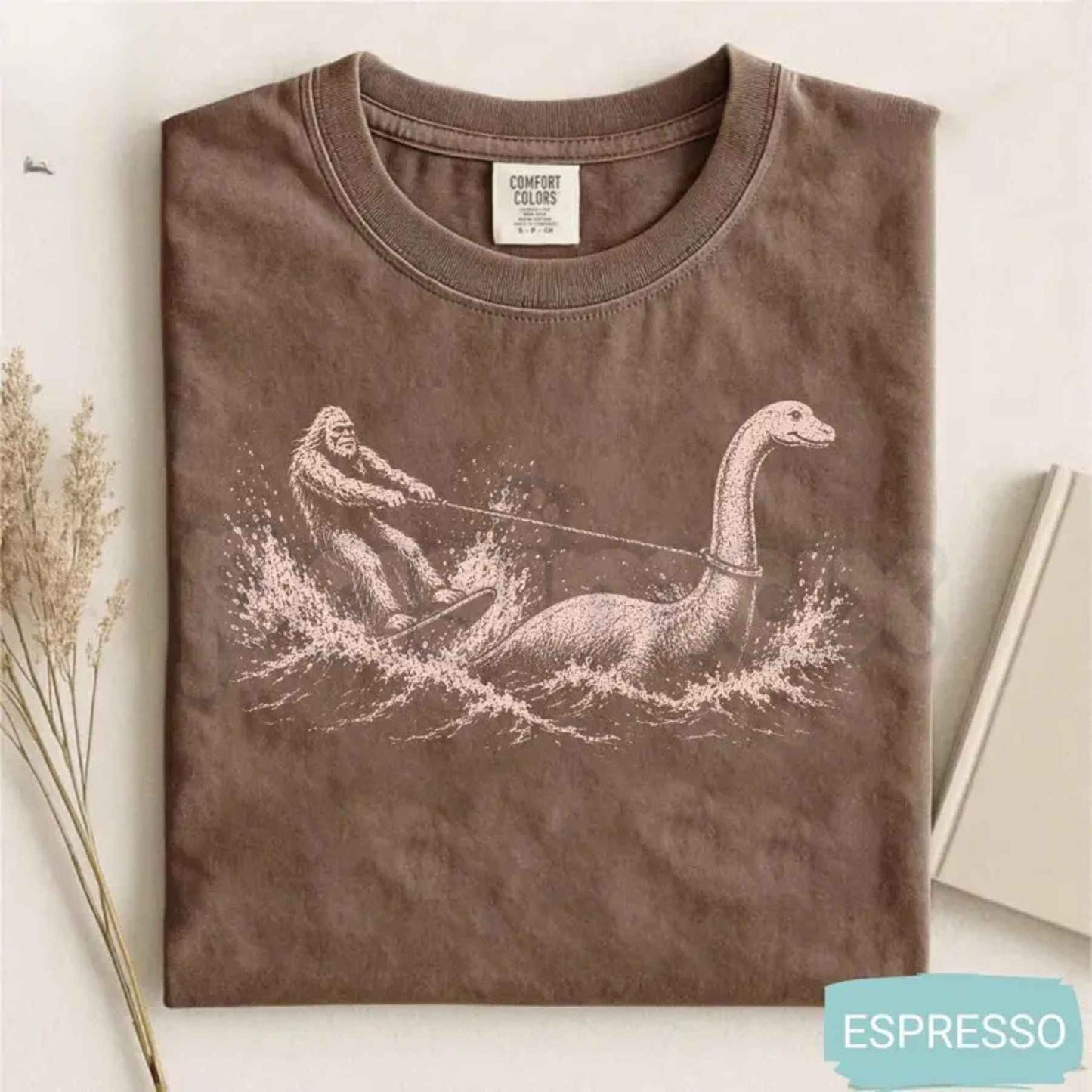 Comfort Colors® Funny Bigfoot & Loch Ness Monster T-Shirt – Retro Cryptid Waterskiing Graphic Tee, Vintage Mythical Creature Lake Life Unisex Top