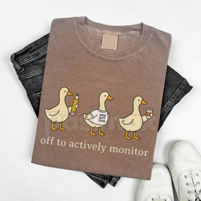 Comfort Colors® "Off To Actively Monitor" T-Shirt – Funny Teacher Testing Day Tee, Sarcastic Proctoring Graphic Shirt, Aesthetic School Testing Season Gift