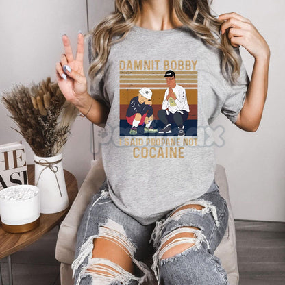 King of the Hill "Propane Mishap" T-Shirt - Hilarious Cartoon Artwork Tee, Unisex Golf Gift, Men's Humor Shirt