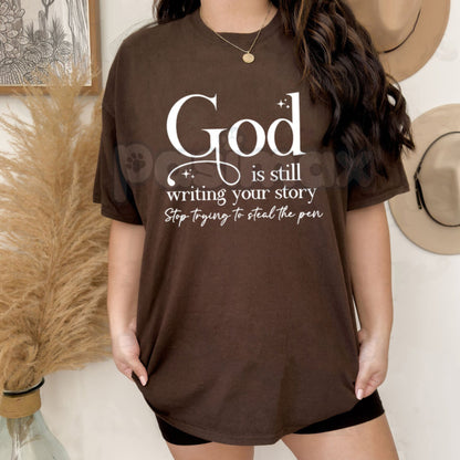 "God Is Still Writing Your Story" Christian T-Shirt – Inspirational Faith Graphic Tee, Premium 100% Cotton Grace Top, Soft Lived-In Heavyweight Storyteller Shirt, Made in USA