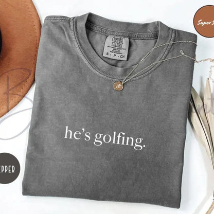 Comfort Colors "He's Golfing" Shirt – Golfer Wife Tee, Funny Golf Player Shirt, Unisex Casual Relaxed Fit, Golf Lover Gift