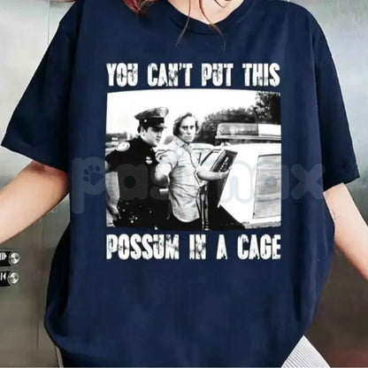 You Can’t Put This Possum In A Cage T-Shirt – Funny George Jones Arrest Outlaw Country Unisex Cotton Tee