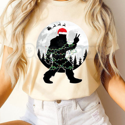 Funny Bigfoot Christmas Unisex Crew Neck T-Shirt – Santa Hat Bigfoot Christmas Lights Moon Graphic Tee