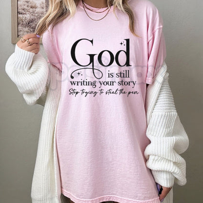 "God Is Still Writing Your Story" Christian T-Shirt – Inspirational Faith Graphic Tee, Premium 100% Cotton Grace Top, Soft Lived-In Heavyweight Storyteller Shirt, Made in USA
