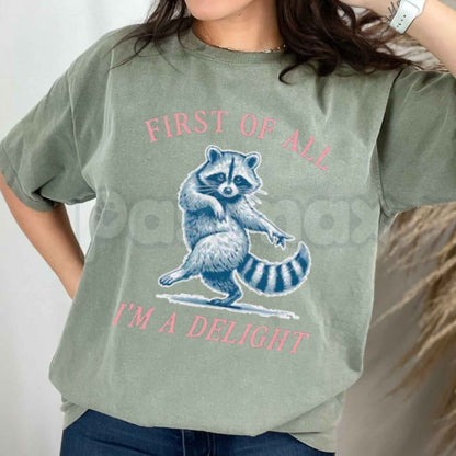 Comfort Colors® "First of All, I'm a Delight" Funny Raccoon T-Shirt – Sarcastic Animal Quote Graphic Tee, Humorous Chaos Unisex Top