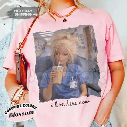 Comfort Colors® Funny Nurse Doll T-Shirt – "I Live Here Now" Disgusting Doll Face Meme Tee, Sarcastic Healthcare Worker Gift, Nursing Humor Shirt