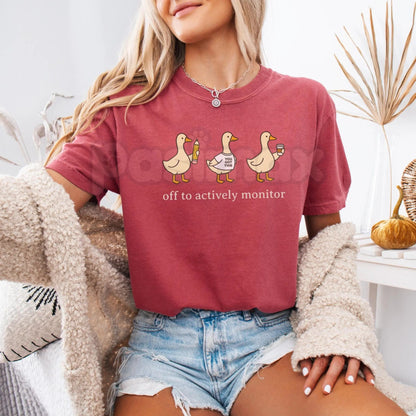 Comfort Colors® "Off To Actively Monitor" T-Shirt – Funny Teacher Testing Day Tee, Sarcastic Proctoring Graphic Shirt, Aesthetic School Testing Season Gift