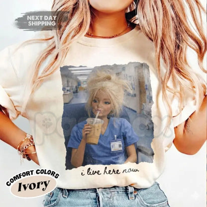 Comfort Colors® Funny Nurse Doll T-Shirt – "I Live Here Now" Disgusting Doll Face Meme Tee, Sarcastic Healthcare Worker Gift, Nursing Humor Shirt