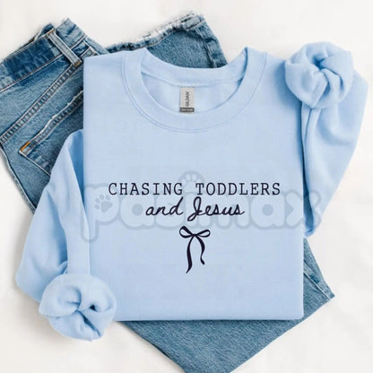 Chasing Jesus and Toddlers Sweatshirt | Coquette Christian Bow Crewneck | Aesthetic Faith Based Mom Jumper | Christian Motherhood Gift | Dainty Religious Bow Pullover-Pasimax
