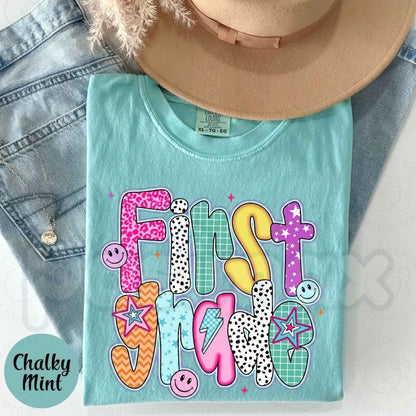 Comfort Colors® Retro "First Grade" Smiley Face T-Shirt – Back to School Aesthetic Graphic Tee, Vintage 90s Vibes Classroom Spirit Unisex Top-Pasimax